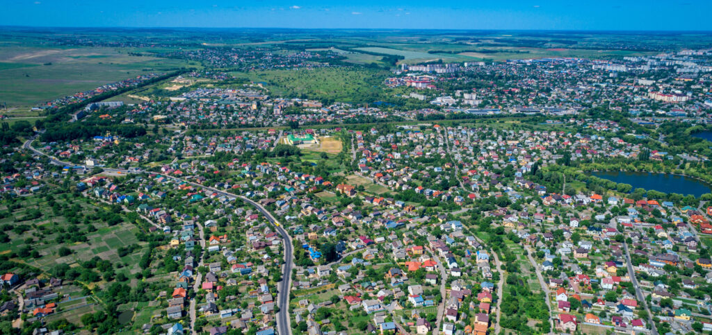 Aerial view of outer Melbourne suburbs with paddocks on the horizon.